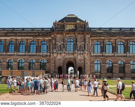 Dresden, Germany - July 26, 2019: Tourists In Zwinger, Palatial Complex In Dresden. Sunny Summer Day