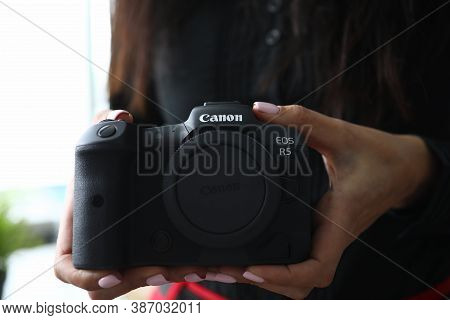 Minsk, Belarus - July 31 2020 : Woman Holding A Camera Canon Eos R5 Closeup. Illustrative Editorial.