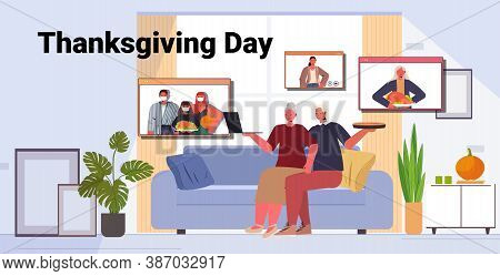 Grandparents Discussing With Children During Video Call Family Celebrating Happy Thanksgiving Day On