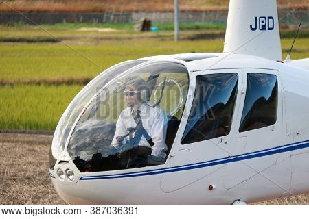 Arashiyama, Kyoto, Japan November 17, 2017: Helicopter Pilot In The Travel Helicopter (ja002r - Robi