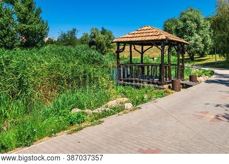 Wooden Gazebo By The Pond In Zaporozhye, Ukraine