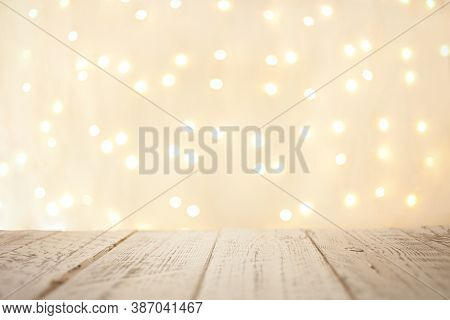Christmas Empty Rustic Wooden Desk Table Over Christmas Blurred Light Bokeh.