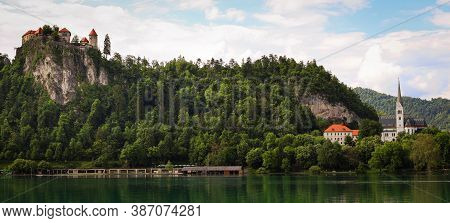 View Of The Bled Castle And Church From A Boat On The Lake