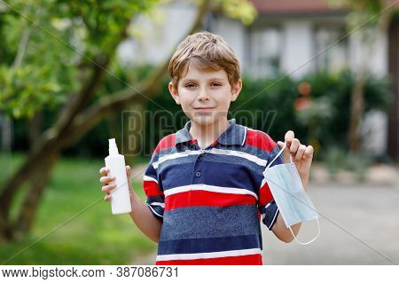 School Kid Boy With Medical Mask As Protection Against Pandemic Coronavirus Quarantine Disease. Chil