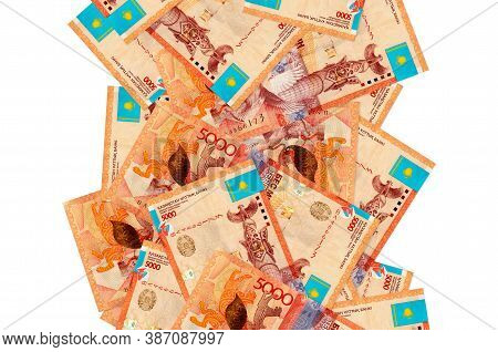5000 Kazakhstani Tenge Bills Flying Down Isolated On White. Many Banknotes Falling With White Copysp