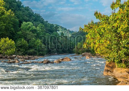 The Ocoee River In Tennessee With Its Whitewater Flowing Downstream Closeup With The Mist In The Mou