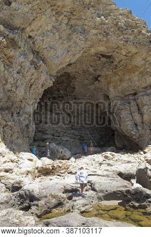 Chernomorsky District, Crimea, Russia - July 21, 2020: Grotto At Cape Big Atlesh Of Tarkhankut Penin