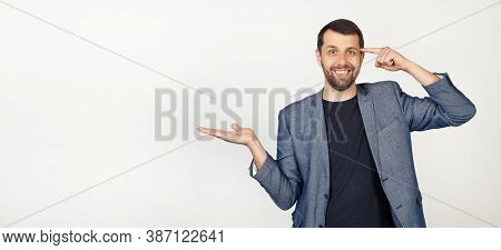 Young Businessman Man With Beard Smiling And Happy With Open Palm Showing Copy Space And Pointing Fi