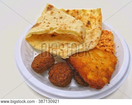 Arabic Food Kuboos And Tamiya In White Plate
