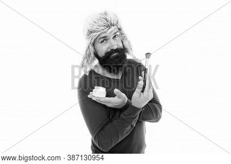 Professional Cosmetics. Applying Makeup Face Tone. Powder Cosmetics. Man Bearded Stylist Wear Hat Ho