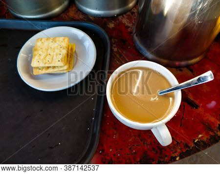 Fresh Hot Milk Tea & Biscuits With A Spoon Served At Tiger Monastery, Bhutan.