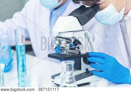 Two Asian Scientist Team Reserch Chemistry Science Tube Experiment Biotech Antibody Sample In Labora