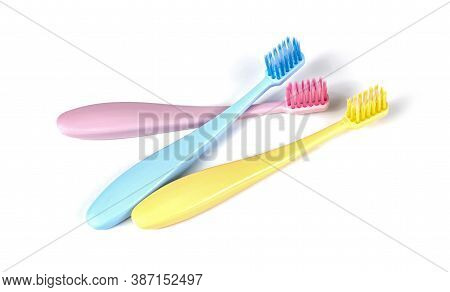 Set Of Colorful Toothbrushes Isolated Over White