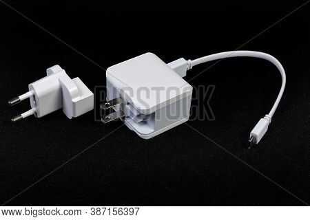 Ac Adapter For Mobile Equipment Batteries Charging With Combined North American And European Ac Plug