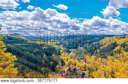 Slavkov Forest Aerial Panoramic View With Small Village, Mountains, Green Hills And Trees Near Karls