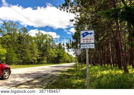 Oscoda, Michigan, Usa - July 20, 2020: Sign For The River Road Scenic Byway In The Huron Manistee Na