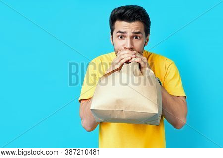 Young Handsome Man Having A Panic Attack On Blue Background