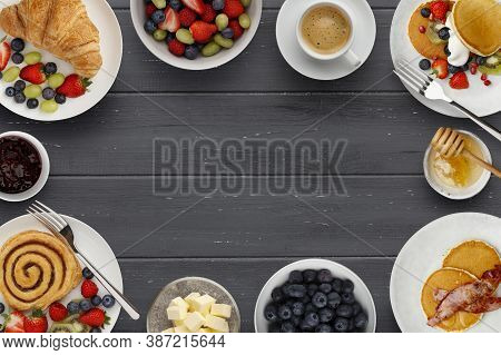 A Border Of Delicious Breakfast Plates, Pancakes And Pasteries, Bowls Of Fruit, Jam And Butter, And 