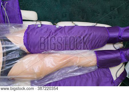 Pressotherapy In The Spa Salon For The Beauty And Health Of The Legs. A Procedure For Treating Legs 