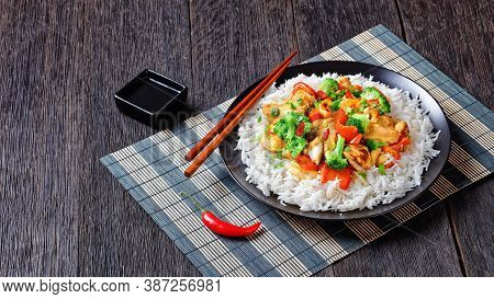 Thai Cashew Chicken With Vegetables Stir-fry: Broccoli, Sweet Pepper, Hot Red Chili, And Soya Sauce 