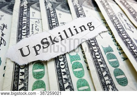 Upskilling Paper Message On Hundred Dollar Bills -- Job And Skills Training Concept