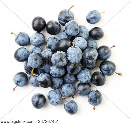Heap Of Blackthorn Berries On A White Background. Isolated