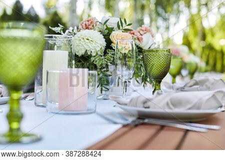 Dinner Tables With White Cloth, Served With Porcelain And Green Glasses. Georgeous Wedding Table Dec