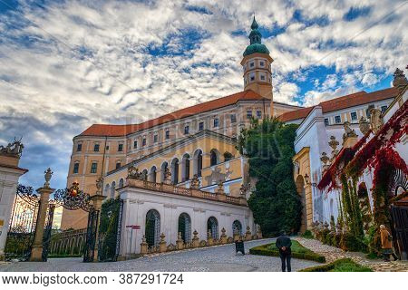 Mikulov, Czech Republic - 10 02 2018: Baroque Castle Mikulov With A High Tower, Paved Area In The Fo