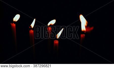 Thin Red Candles On A Black Background, Panoranic