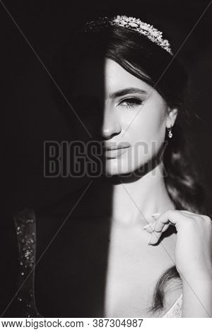 Black And White Photo Of Gorgeous Model. Hulf Of Face In Shadow