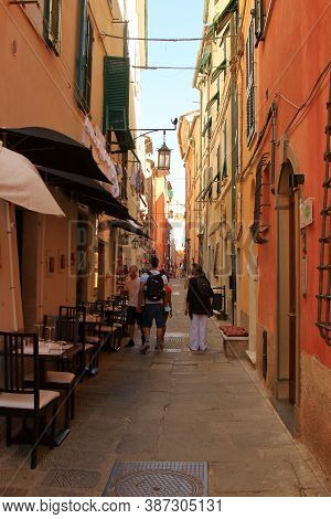 Portovenere, Five Lands, Italy - Summer2020: Tourists With Backpacks Walk The Streets Of Portovenere