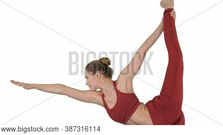 Yoga Teacher Practising Pose Dandayamana Dhanurasana On White Ba