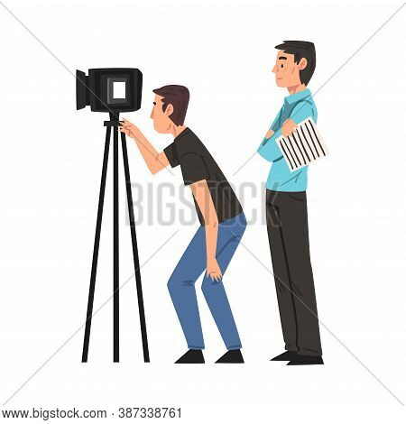 M Cameraman Shooting With Video Camera On Tripod, Anchorman Standing Next To Him, Television Industr