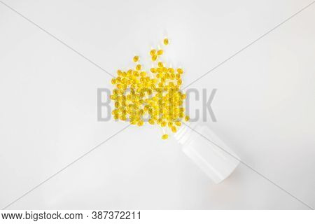 Creative Concept Vitamin D3, Sunshine Vitamin. Capsules In A White Bottle. Copy Space, Minimalism, T