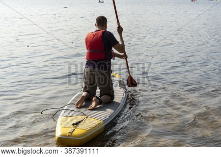 Standup Paddleboarding Are On The River Moscow, Strogino.