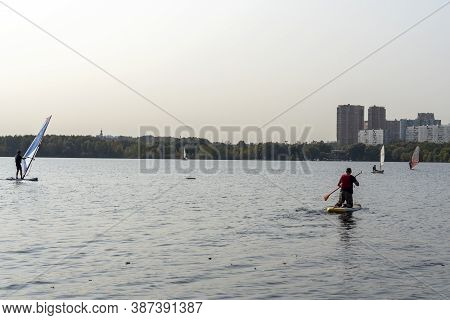 Standup Paddleboarding Are On The River Moscow, Strogino.