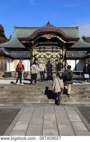 Kamakura, Japan - December 3, 2016: Tourists Visit Karamon Gate Of Kenchoji Temple In Kamakura, Japa