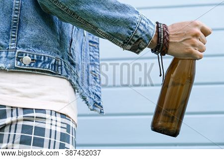 A Brown Bottle Of Beer In A Hand Of Punk, Informal Woman, Alcohol Addiction, Overdosage And Abuse Co