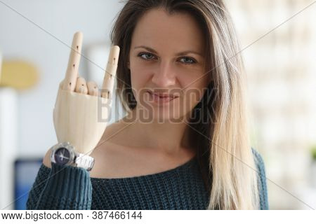 Disabled Young Woman Shows Wooden Denture Gesture Portrait. Prosthetics Of Limbs With Perfect Workin