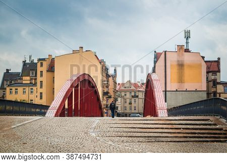 The Red Bridge To Tumskiy Island, View In Rainy Day: Poznan / Poland - September 29, 2020