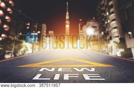 New Life Road Signage Leading To A Bright Modern Night Tokyo City For New Business Begining Concept.