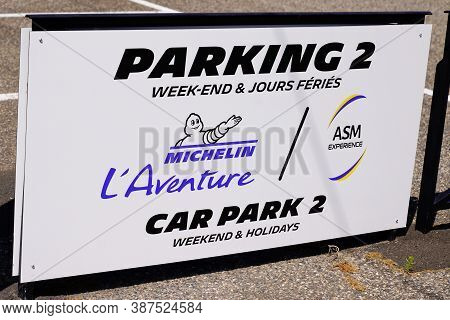 Clermont-ferrand, , Auvergne / France - 09 01 2020 : Michelin L'aventure Bibendum Logo For Car Park 