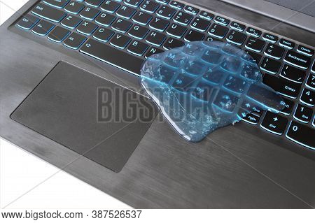 Blue Soft Gel Cleaning Dust On Keyboard. Concept Cleaning Your Computers Keyboard. Office Cleaning.