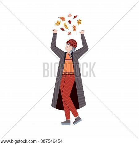 Girl In Warm Clothes Throws Red, Yellow And Orange Autumn Leaves. Young Woman Is Enjoying The Fall S