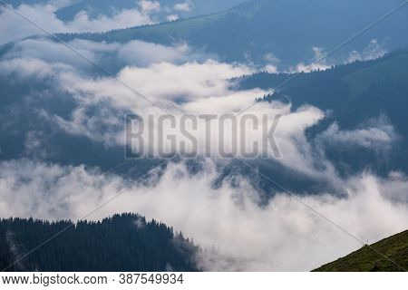 Summer  Misty And Cloudy Morning Mountain Tops With Low Clouds. Marmaros Carpathian, Ukraine.