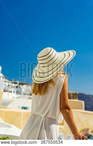 Woman on holidays in Santorini island in Greece