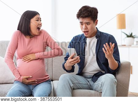 Preterm Delivery. Shocked Asian Husband Calling Emergency For Pregnant Wife Shouting Suffering From 