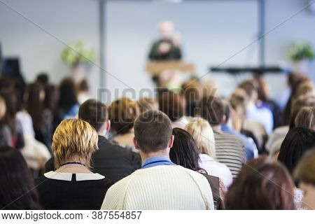 Conferences Concept. Male Lecturer Speaking In Front Of The Audience During The Conference. Horizont