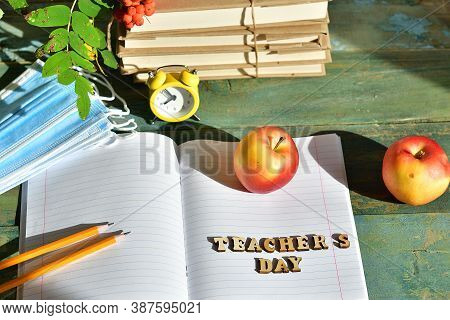 Wooden Letters Teacher's Day On The Notebook.happy Teacher's Day. Books, Rowan, Apple And Medical Pr