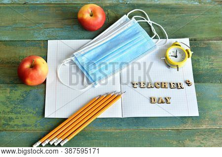 Wooden Letters Teacher's Day On The Notebook.happy Teacher's Day. Books, Rowan, Apple And Medical Pr